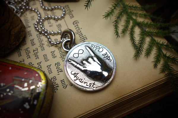 Silver Pendant „AGAINST ALL ODDS“