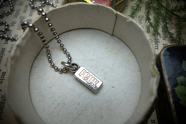 Silver Pendant „FCUK“